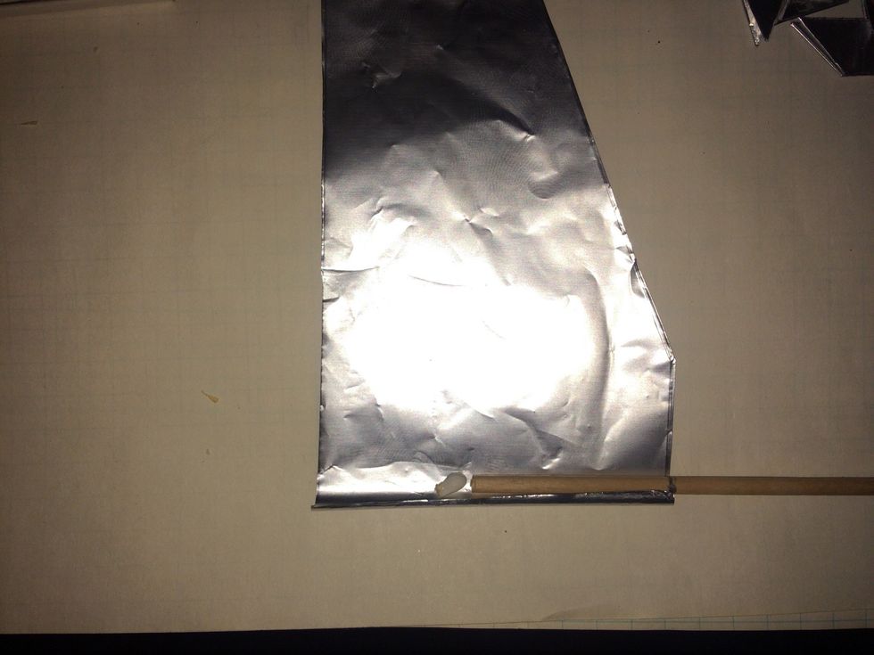 Start with apiece of foil and a dowel. On the dowel make a mark 11/2" down on one end. Place dowel on foil up to mark and place a match head on foil at end of dowel.