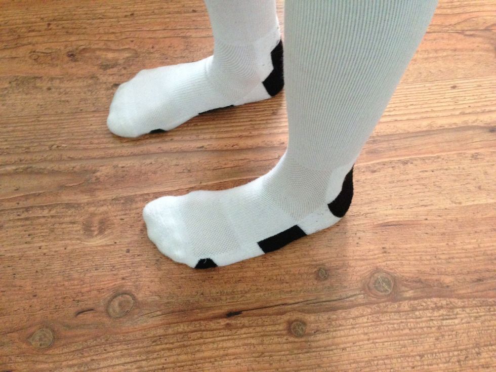 Start with both feet on the ground parallel