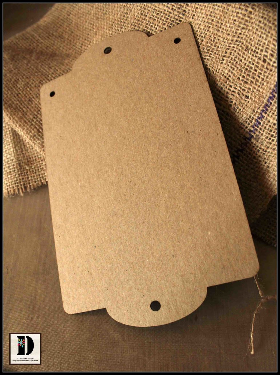 Start with collecting supplies, such as your chipboard banner panel and the burlap.