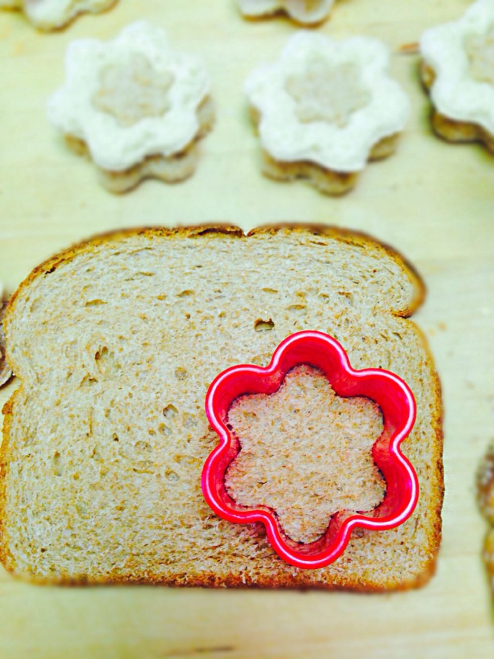 Start with cutting sliced bread into flower shapes