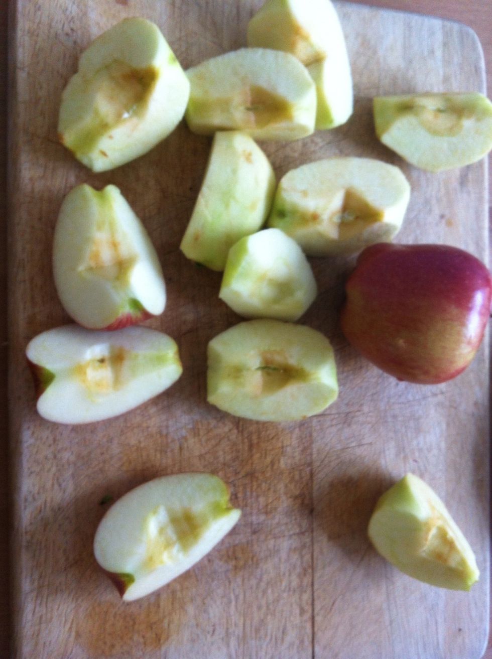 Start with dividing the apples into four; take out the seeds and peel them.