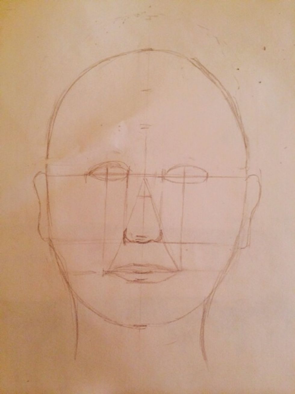 Start with facial grid. Pupils align with edges of rested lips. Corners of eyes align with sides of nose.