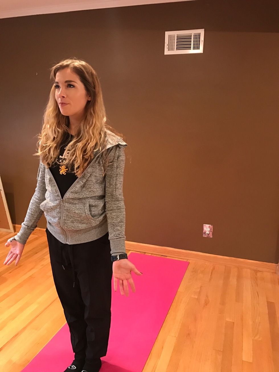Start with feet together at the top of the mat. Stand tall, with your arms at your sides, relax shoulders. Begin to breathe deeply.