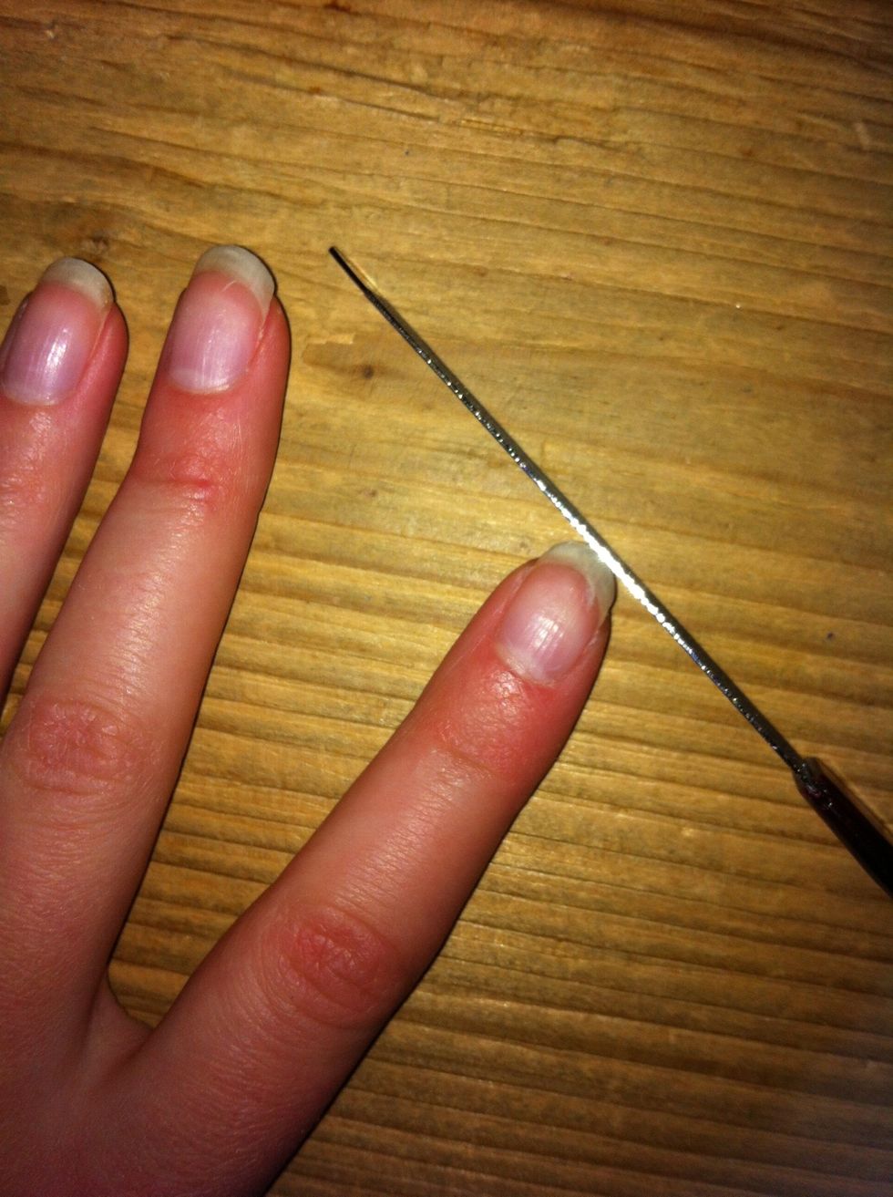 Start with filing your nails in one direction.