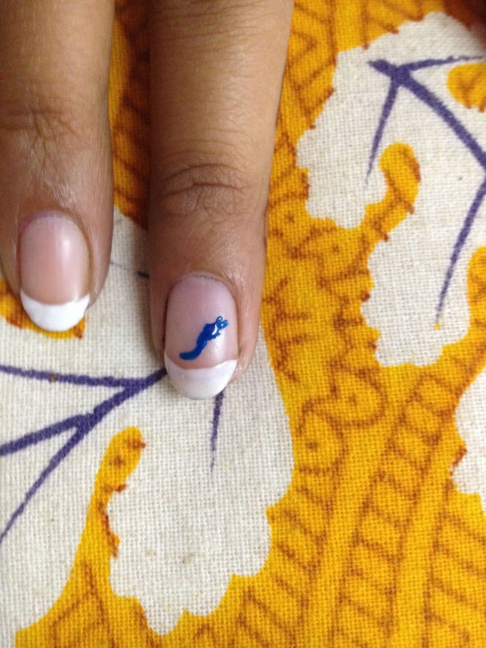 Start with French tips and a curved line for the body of the butterfly.