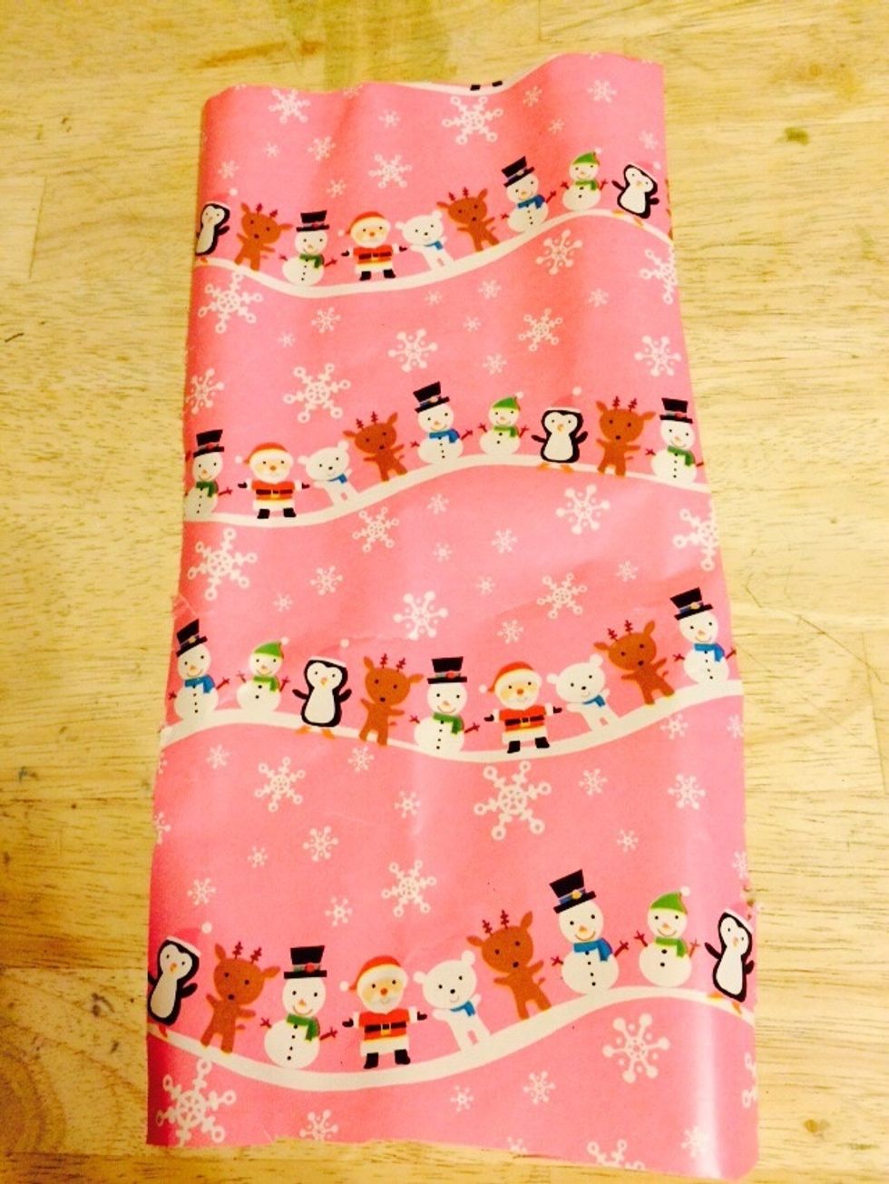 Start with paper of choice. Wrapping paper, construction paper, paper out of magazines, books or anything else you like.