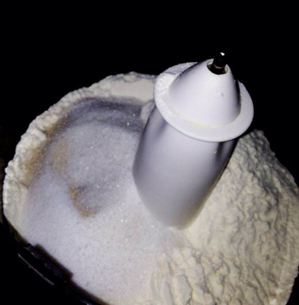 Start with putting dry ingredients in a mixer fixed with a paddle on a low speed to combine.