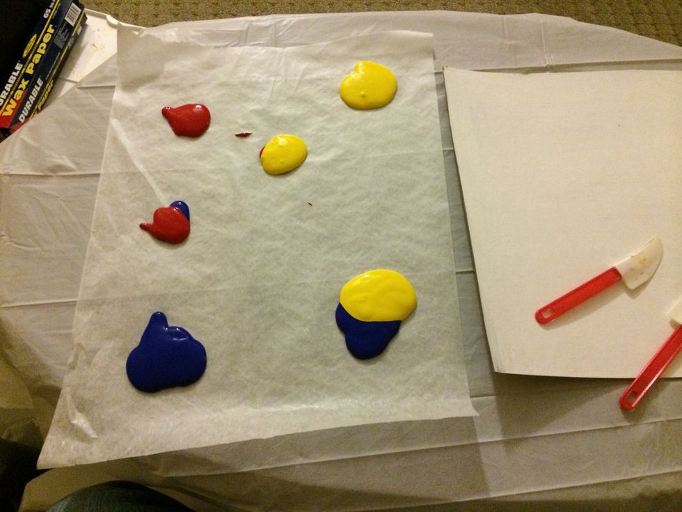 Start with red, yellow and blue paint. Mix for green, purple and orange.