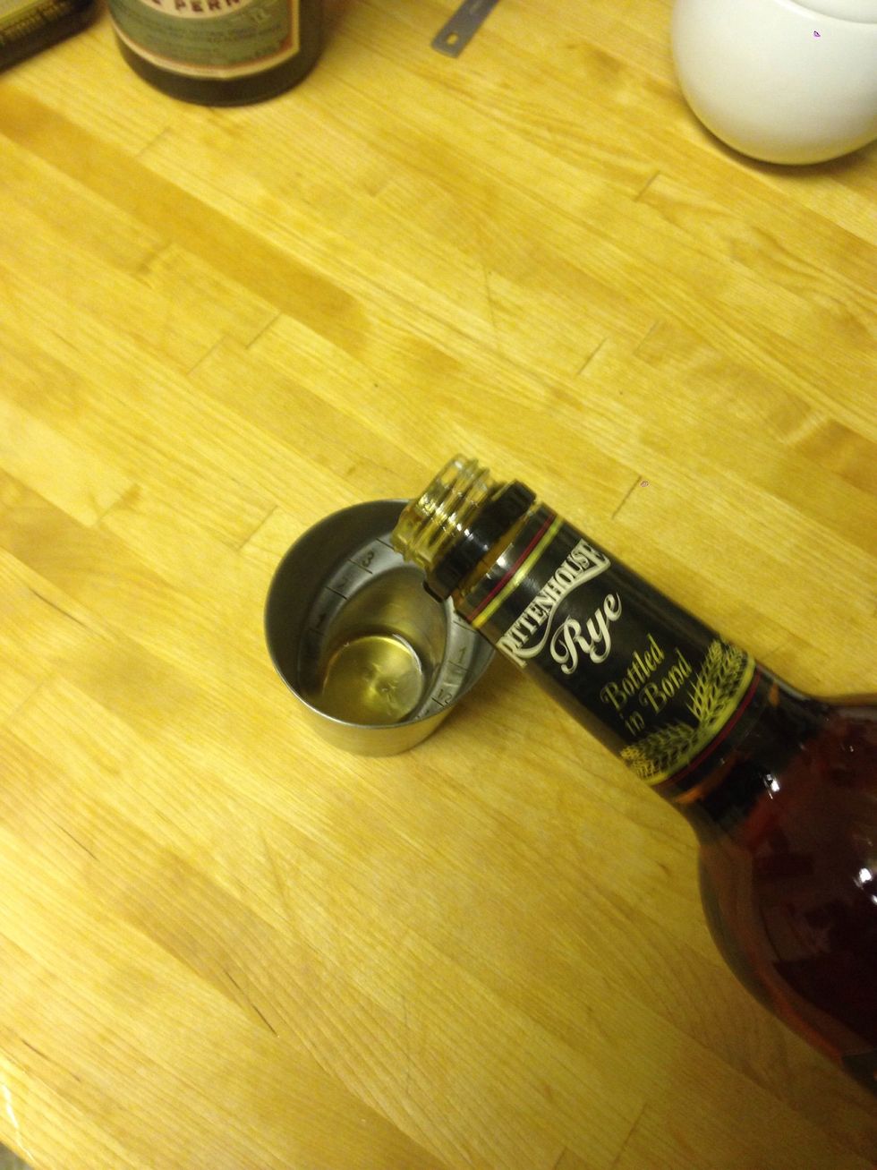 Start with rye, measure 2 oz rye. Pour in mixing glass.