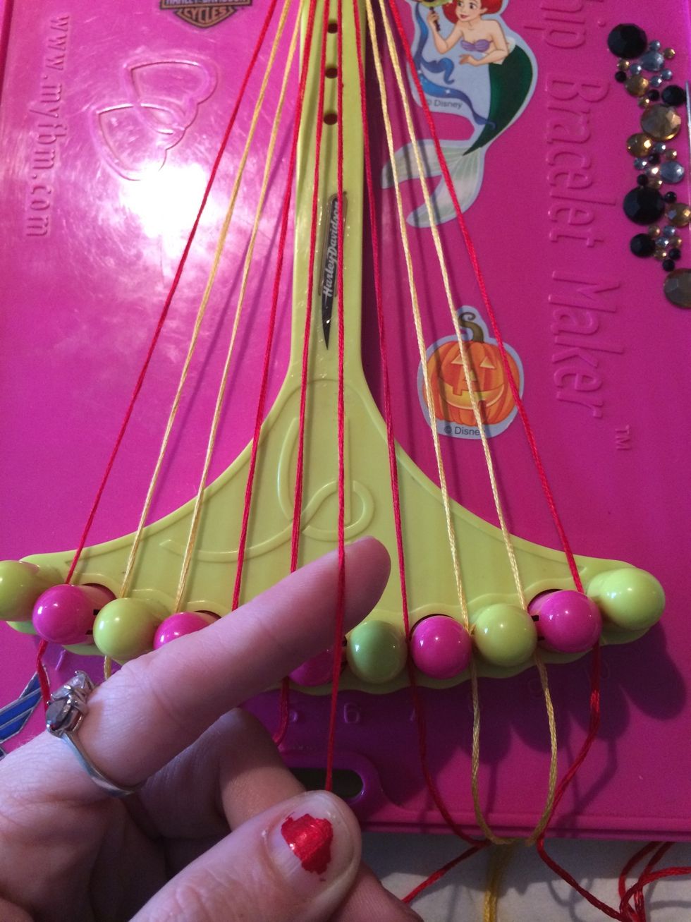 Start with the 6th string. We are going to be working with the right side first. We will be making Forwards knots across all 4 strings.