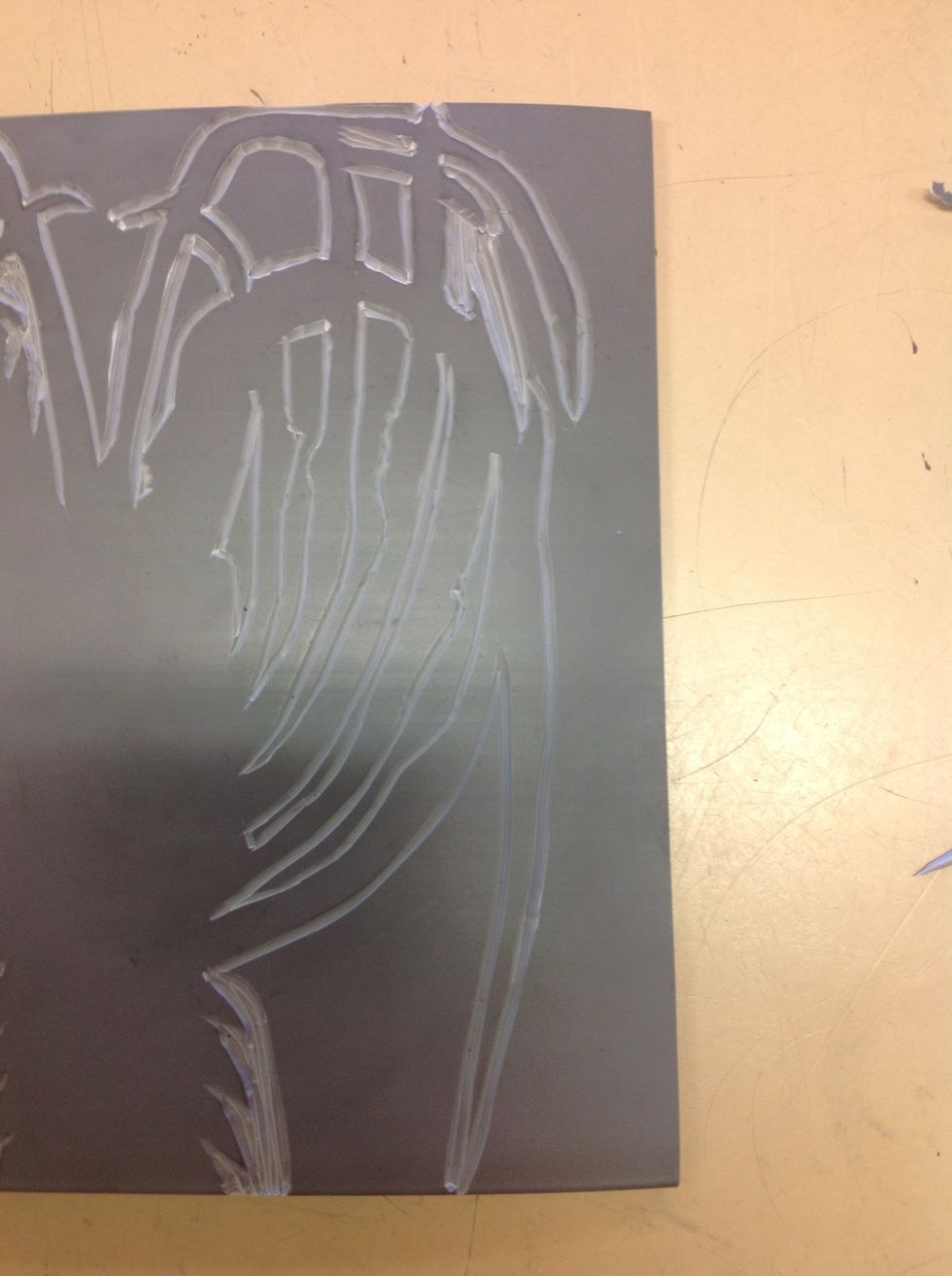 Start with the outlines, cutting fine lines with the v-shaped tool. Then carve out the larger areas with the u-shaped tool. Don't worry about the outside areas as we will be cutting out the animal.