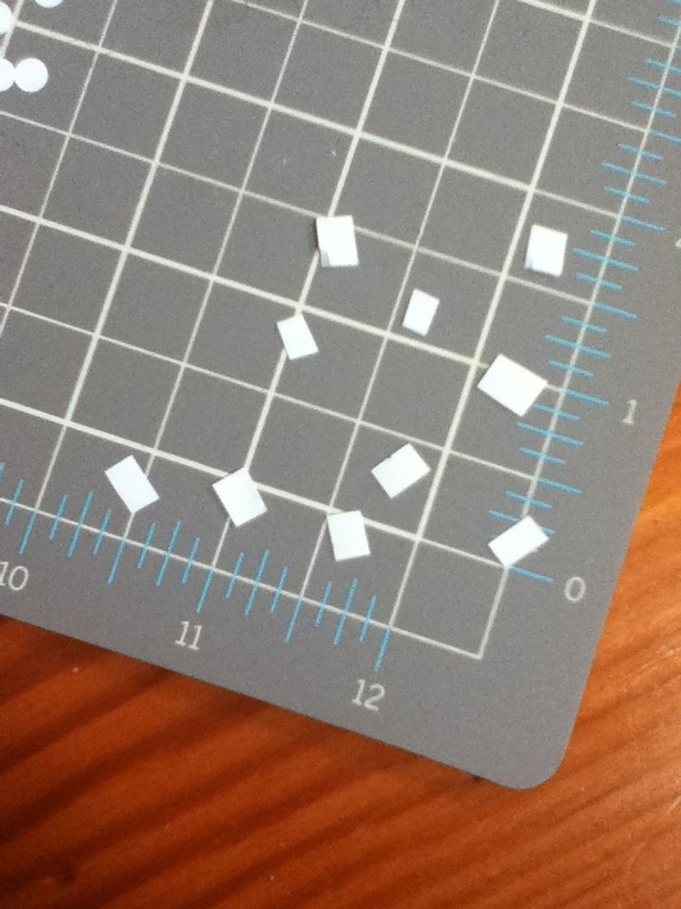 Start with the preparation. Cut your double sided tape into tiny pieces. Quantity doesn't matter; if you need more, cut more later.