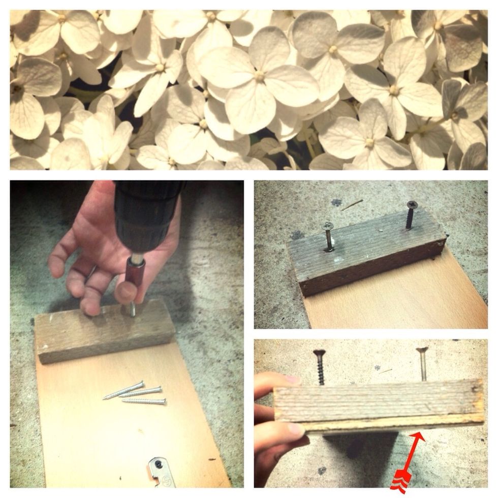 Start with the smaller strip of wood and screw it to the end of your board (mine is a leftover laminate piece). Make sure that the screws don't come through at the bottom!