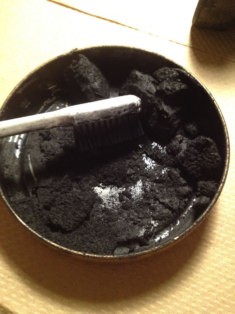 Start with the toothbrush, get a lot of polish on it.