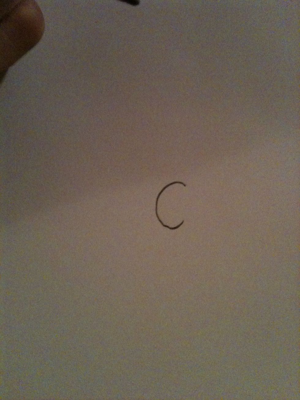 Start with writing a c on your paper....