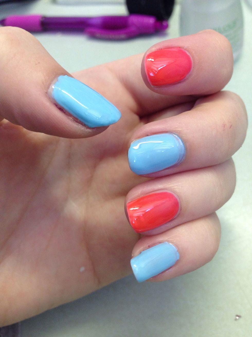 Start with your base color. You could do all nails one color, alternating or each nail a different color. Put on a fast drying topcoat in case you mess up the lines or dots; mistakes can be wiped off.