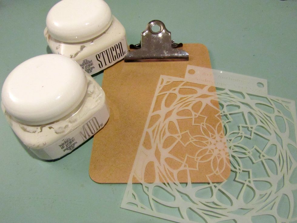 Start with your clipboard and cover with a layer of Art Anthology Mud.