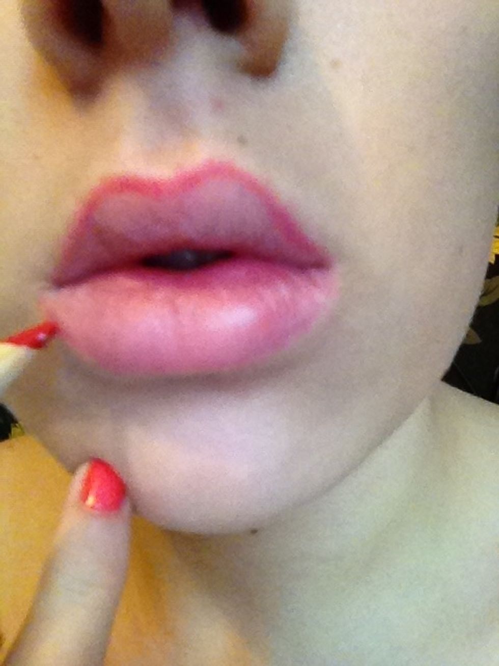 Start with your cupids bow and then follow the line round the whole of your lips