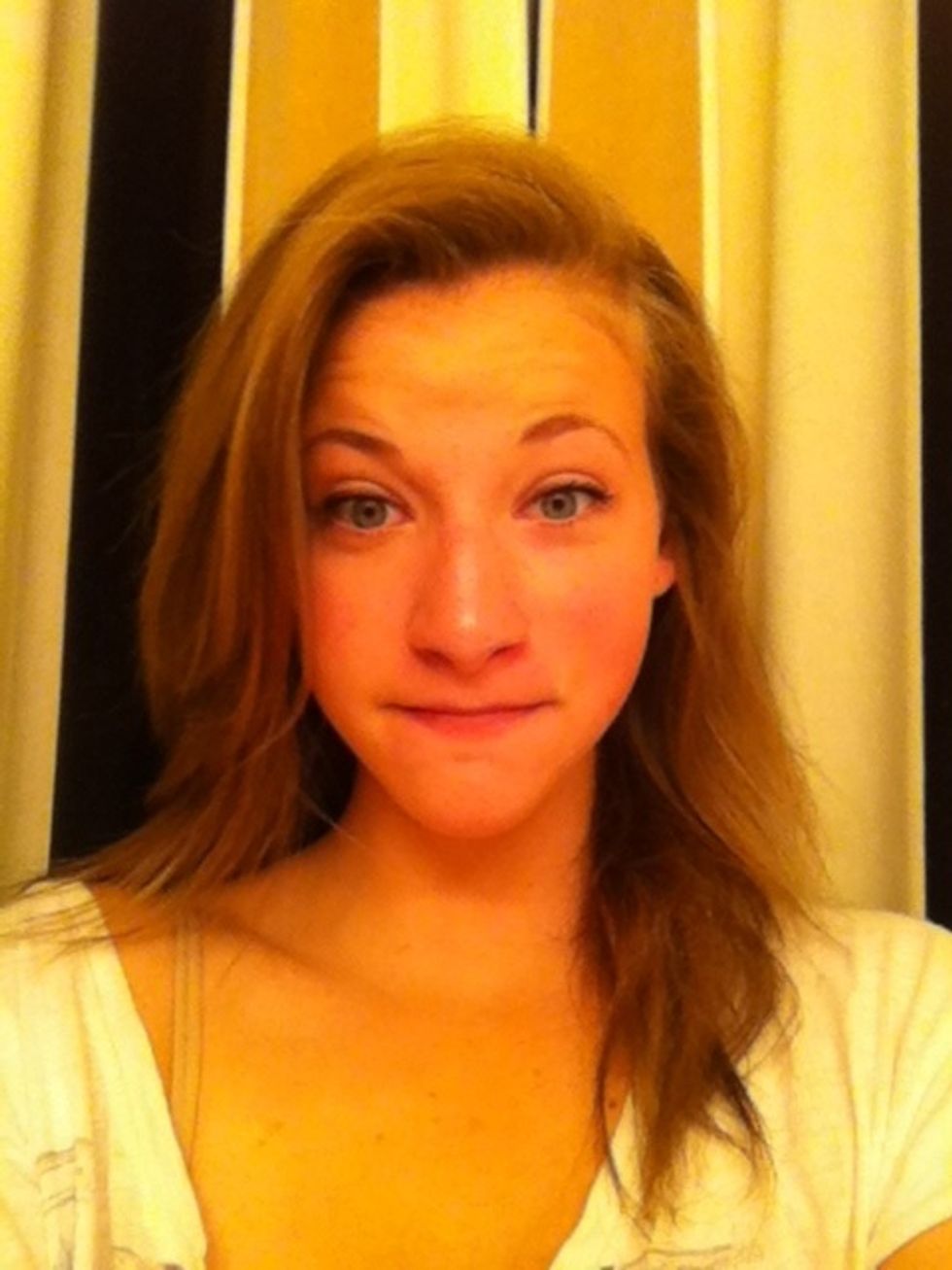 Start with your hair down, it should be completely dry. As you can see, your hair doesn't need to be extremely long in order to do this hairstyle. My hair is only a few inches past my shoulders.