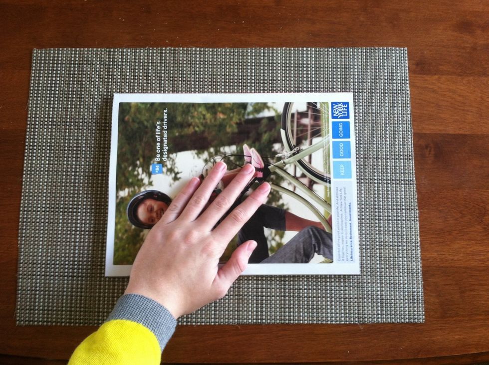 Start with your protective surface (newspaper/magazine) and clean, bare nails.