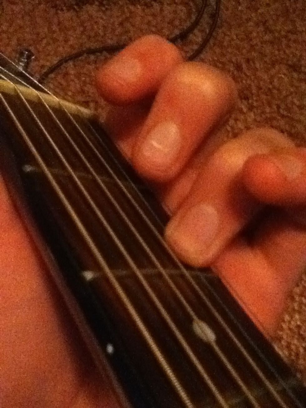 Start with your ring finger on the second string, second fret.