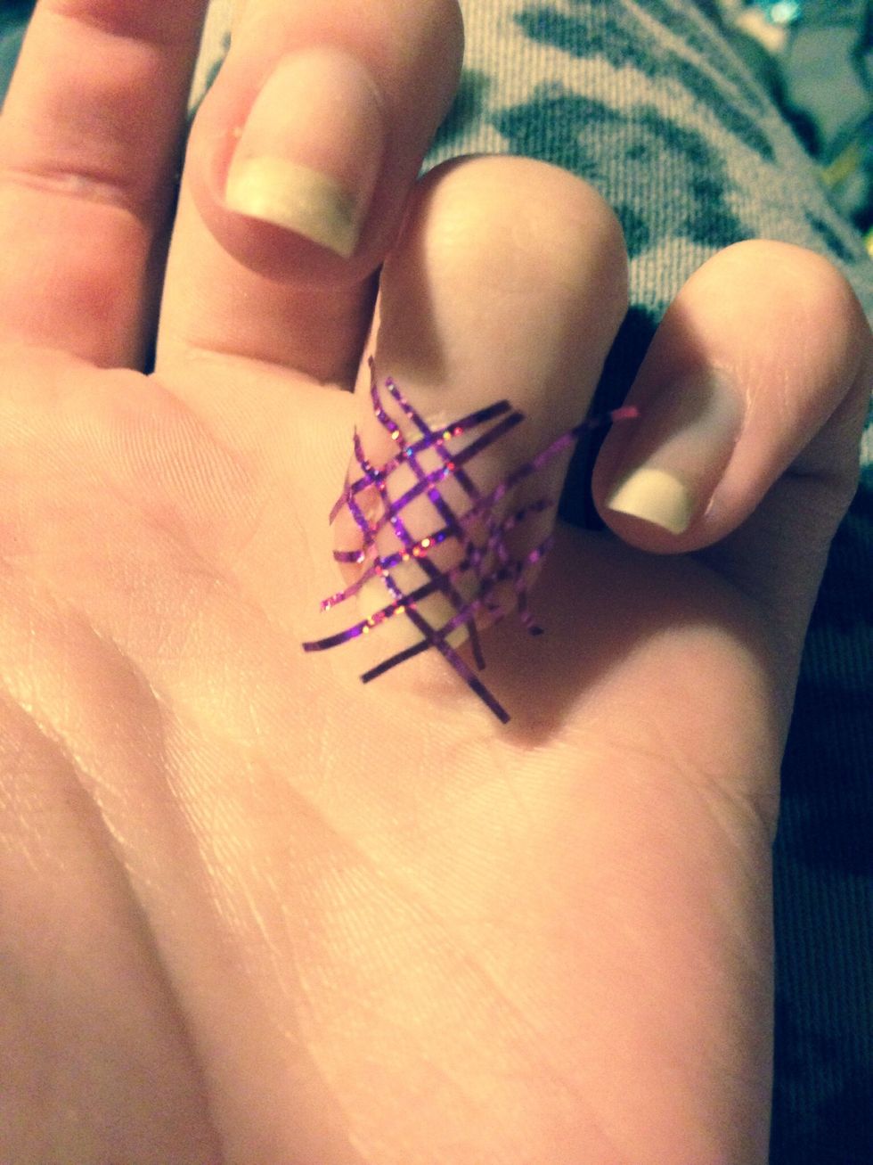 Start with your striping tape in a criss cross pattern