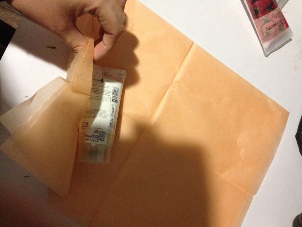 Start wrapping, open up the paper and roll it on one side