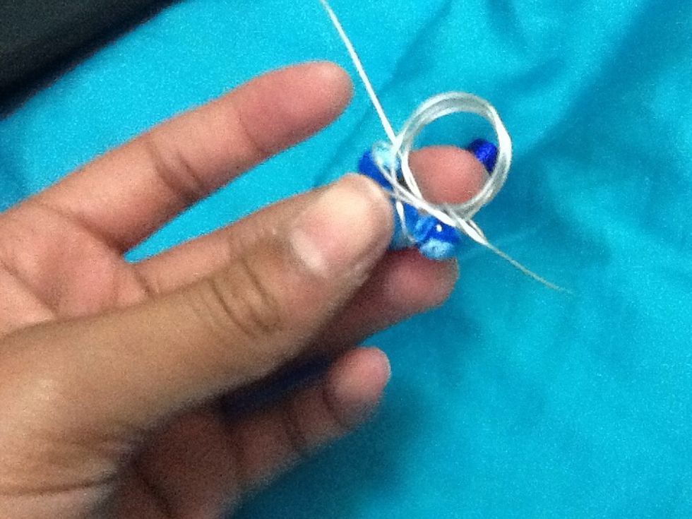 Start wrapping the extra wire around the "base" wire