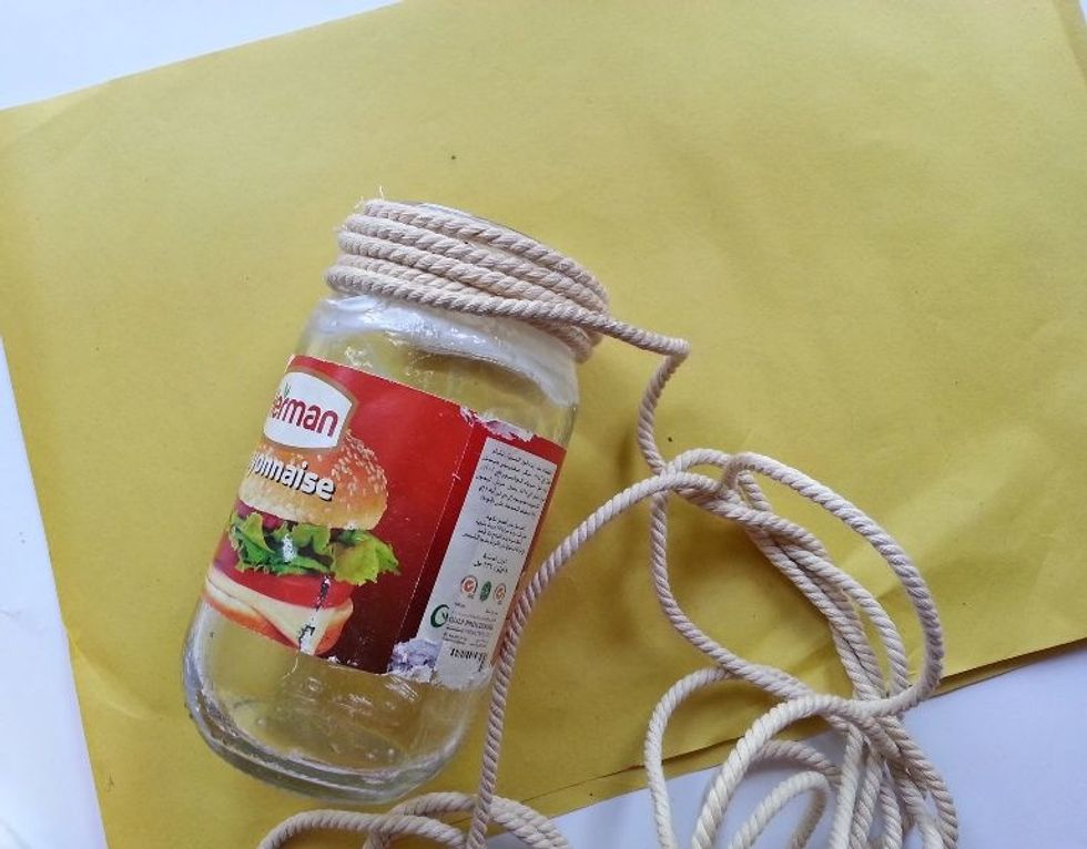 Start wrapping the twine around the glued part. Wrap the twine nice and evenly without leaving any gaps between each row.