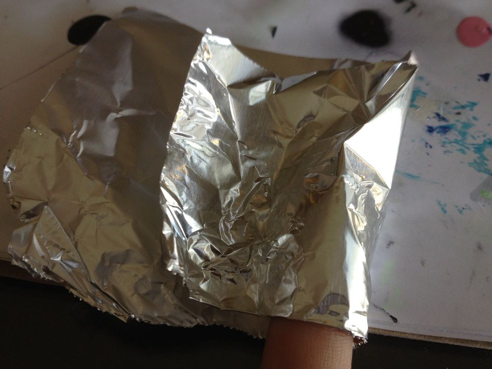 Start wrapping your foil over your nail. (Wrap one side over then the other.)