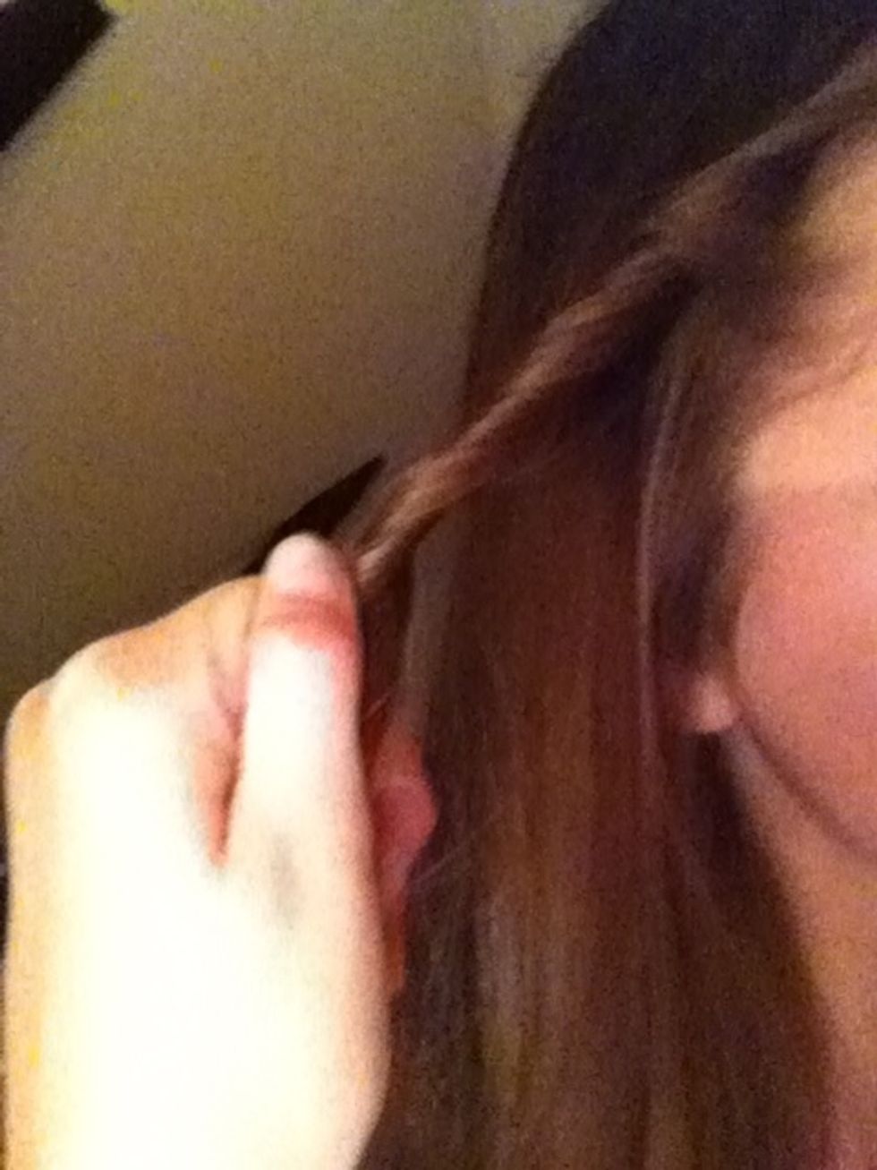 Start 'wrapping' your hair around, like this.