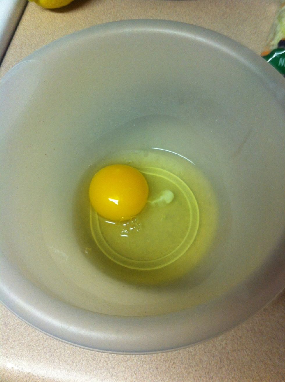 Start your beer batter. Crack egg into bowl.