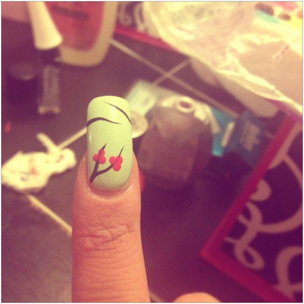 Start your cherry blossoms, and add pink dots with a dotting tool. 3 dots should do.