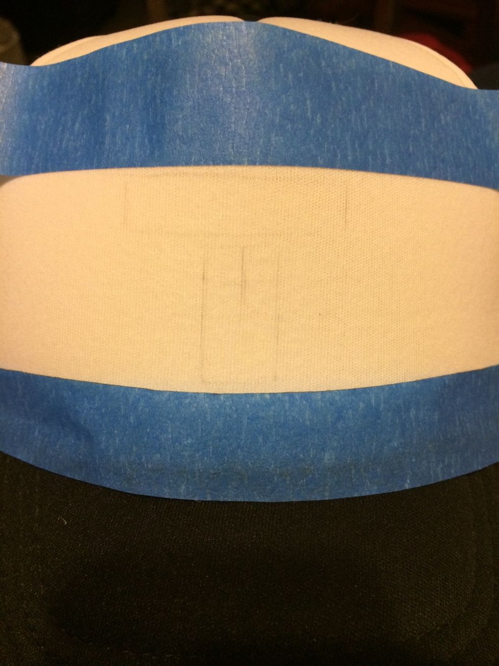 Started to draw "T".  If it's a word you're drawing make sure to count the letters and draw the middle letter or letters so it can come out even on both sides