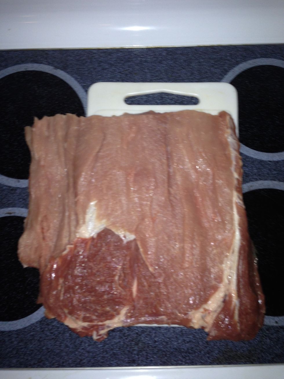 Starting 3/4" up from the bottom, cut into the loin and roll away from the knife until you have a flat piece between 1/2 and 3/4 inches thick across.