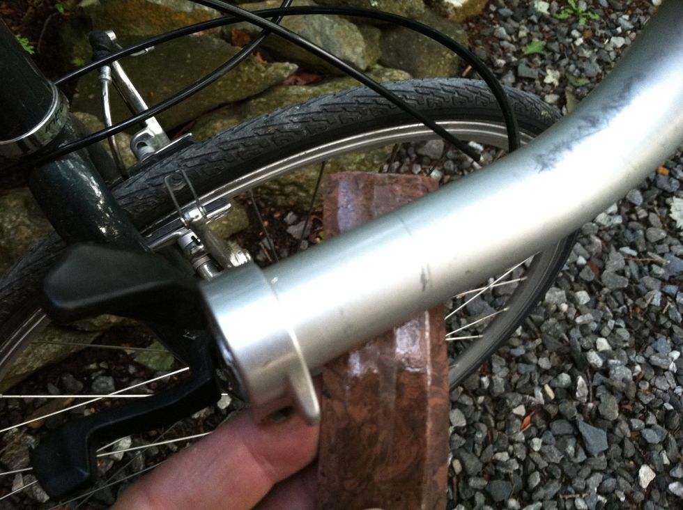 Starting at the bar end, place the underside of the tape against the underside of your bar and angle towards the back of the bike with the tail end of the tape away from the bike.