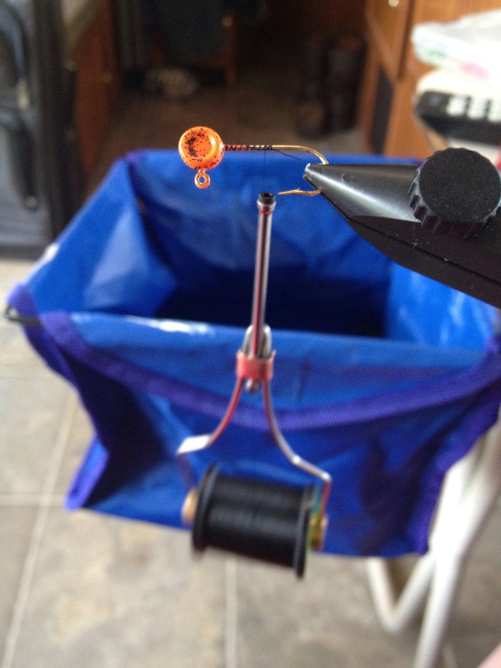 Starting at the head you then run your thread down the shank almost to the hook tip then back up to the head to secure it in place. You should be able to let the bobbin hang freely now.