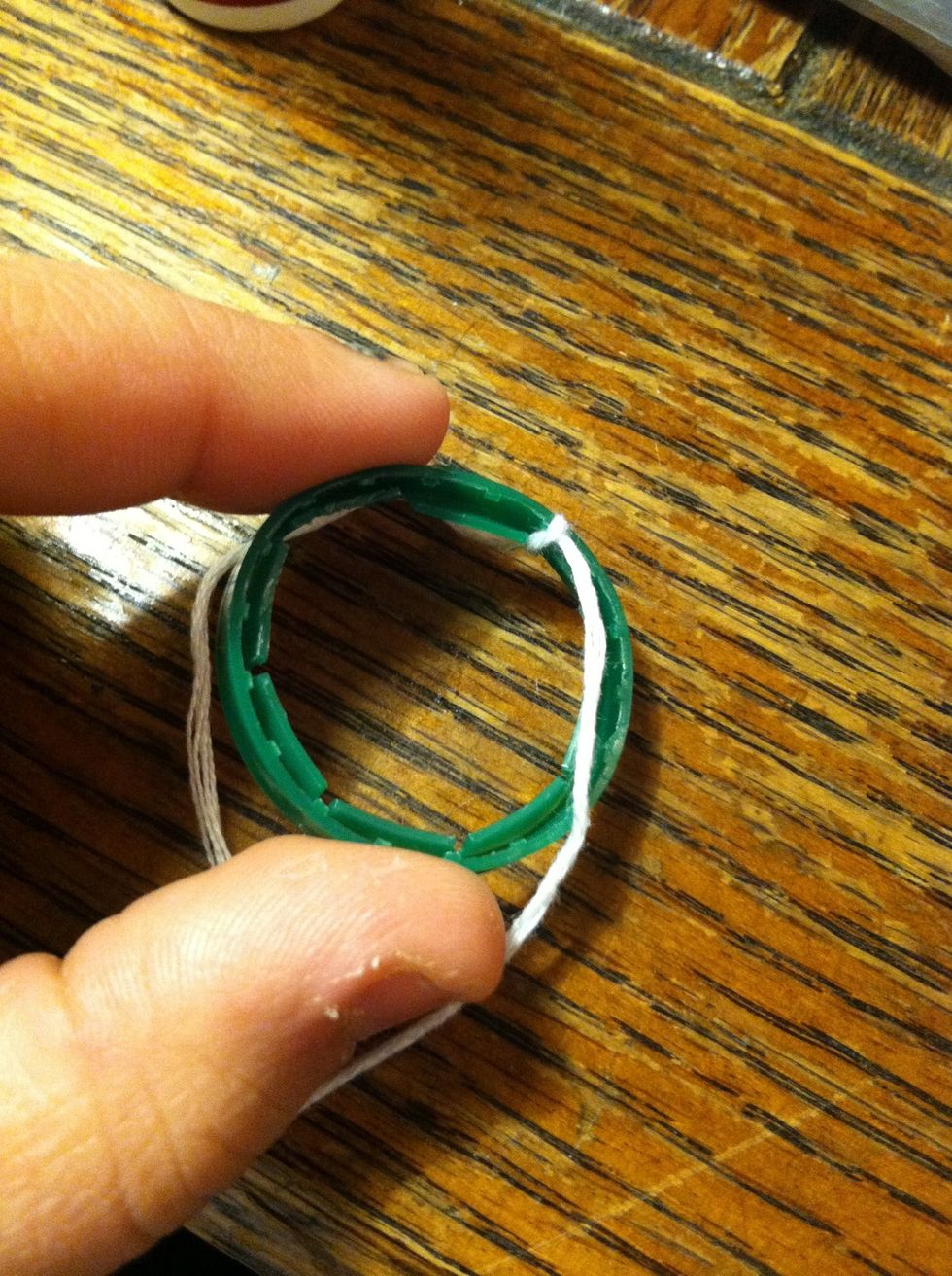 Starting at the opposite end tie your string on and start wrapping. If you aren't sure how to do this check out my first guide "how to wrap bottle rings".
