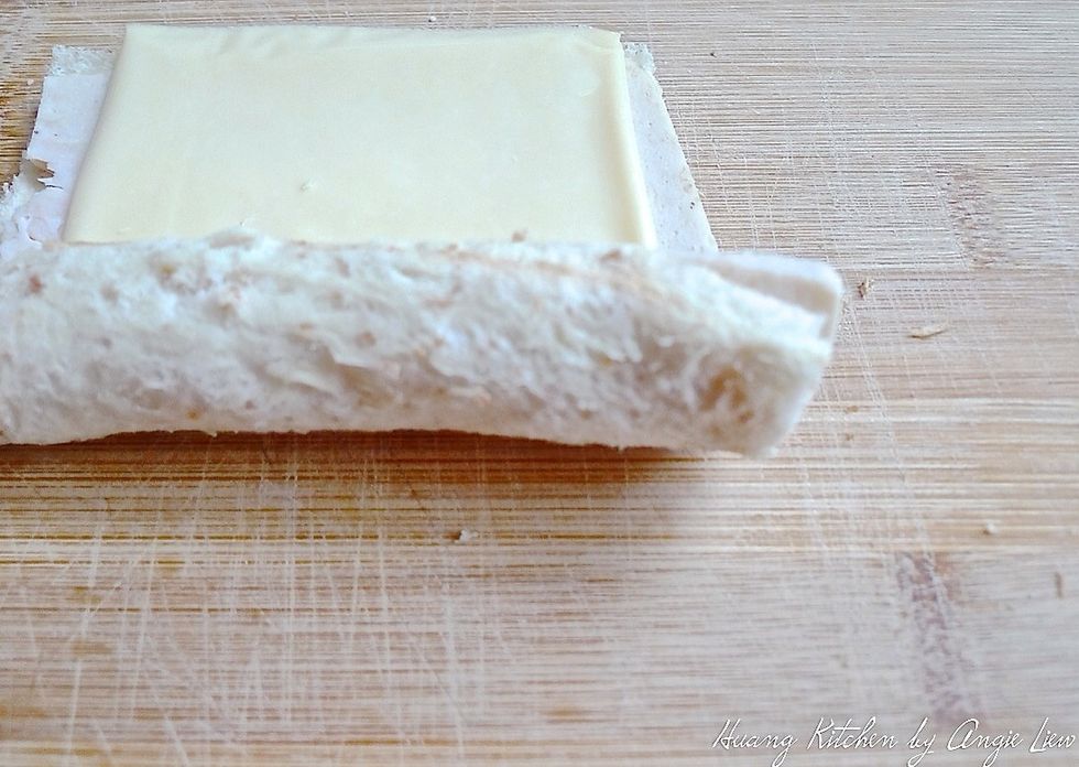 Starting at the side closest to you, tightly roll the bread up.