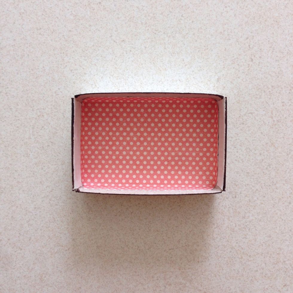 Starting from the base, glue down the pattern paper...