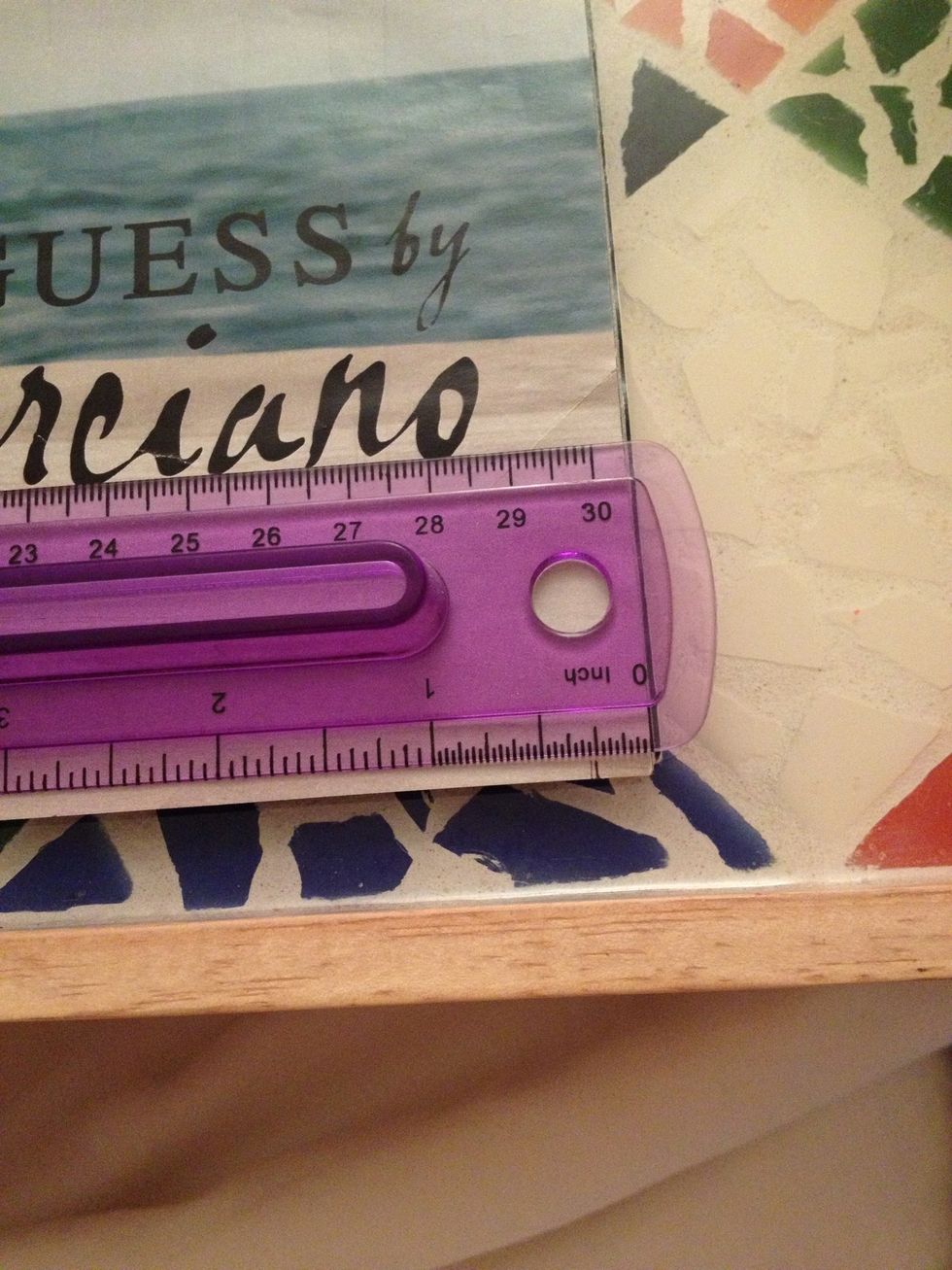 Starting on the end of the page, use your ruler to measure and mark the point that is half of your desired bead width. So if you're doing 1/2in beads, your first mark would be 1/4in from the edge.