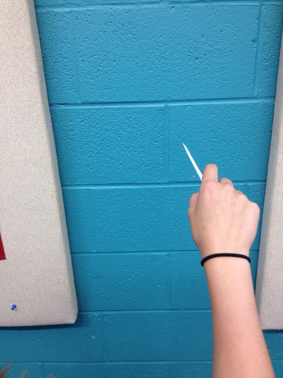 Starting position. Relax your hand but hold the baton securely.