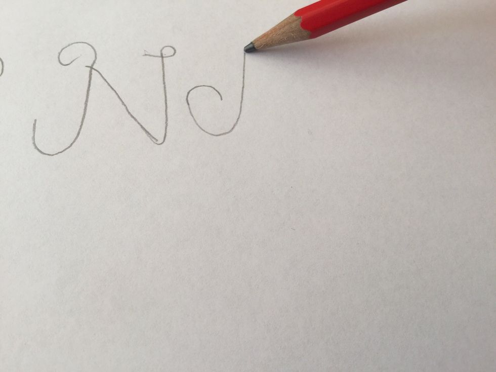 Starting your "A" draw a semi circle then come down and straight up again