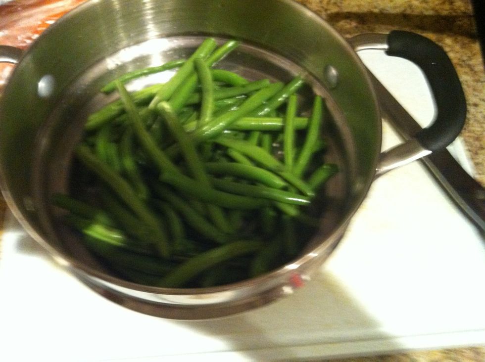 Steam green beans for 10-15 minutes