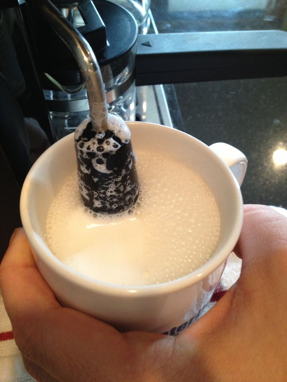 steam milk with the tip spout to create bubbles