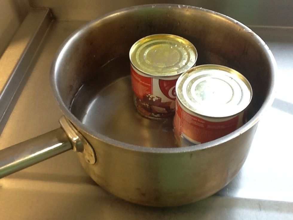 Steam or boil the condensed milk for 3 hours. Top up water at regular intervals.