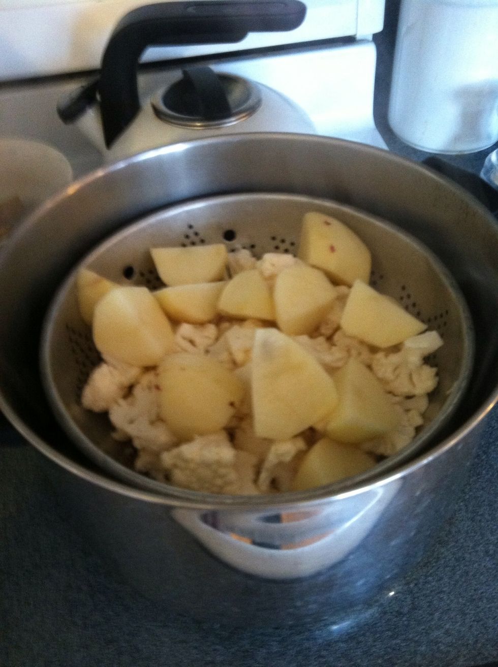 Steam the cauliflower and potatoes until soft