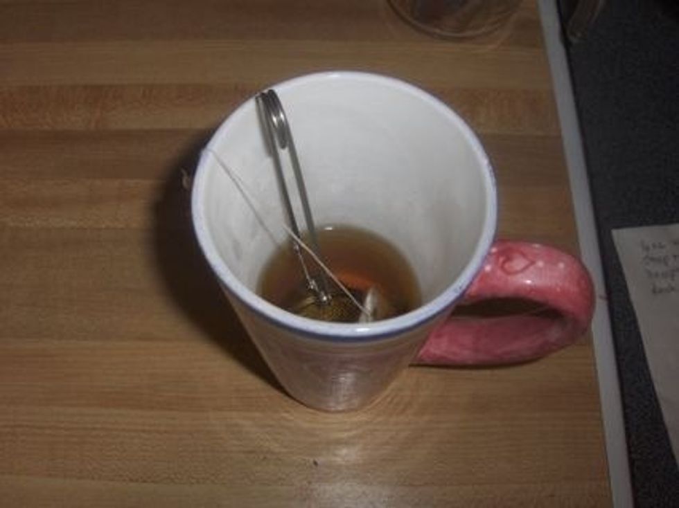 Steep tea and cloves(in tea strainer) for about two minutes- longer if you like your chai stronger.