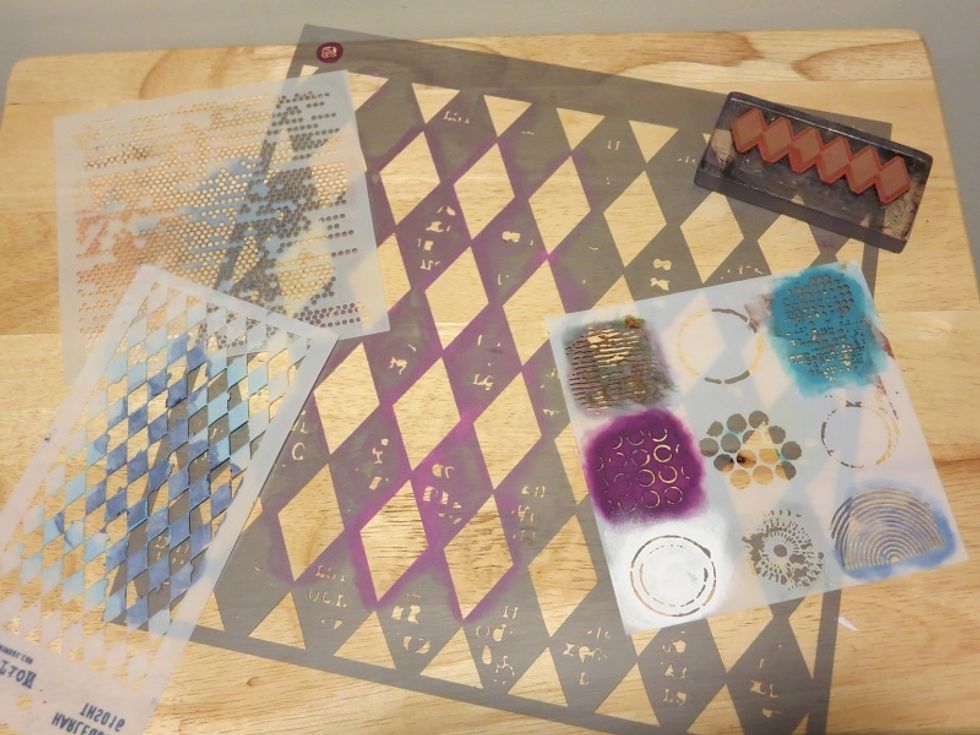 Stencils and a rubber stamp gave it another layer of color and texture. A lot of diamond shapes were used.