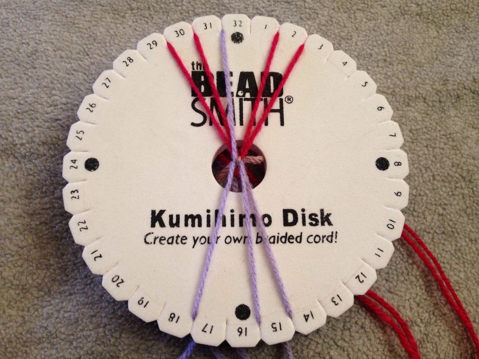 STEP 1 - First off take thread 16 up to slit 31. The basic rule of Kumihimo is the thread on the left goes up to the left and right threads go to bottom right.